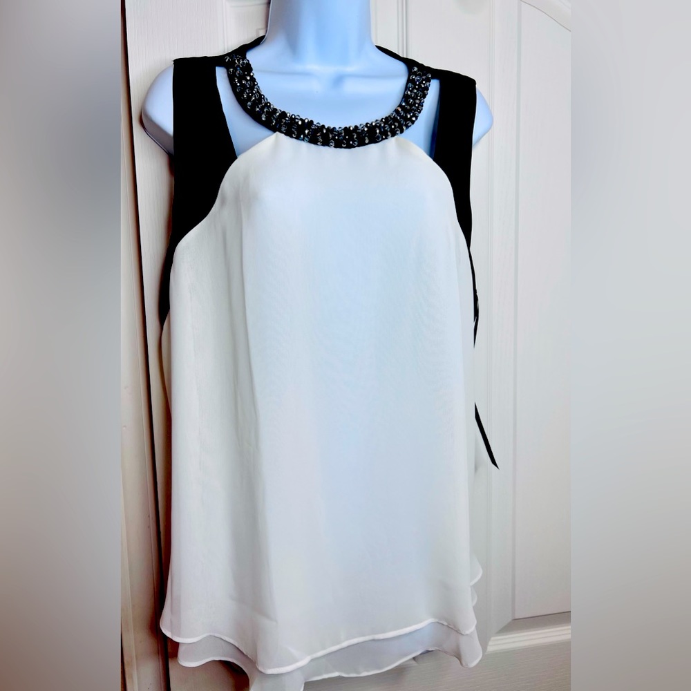 Sleeveless jeweled chiffon blouse with jeweled neck. Jennifer Lopez